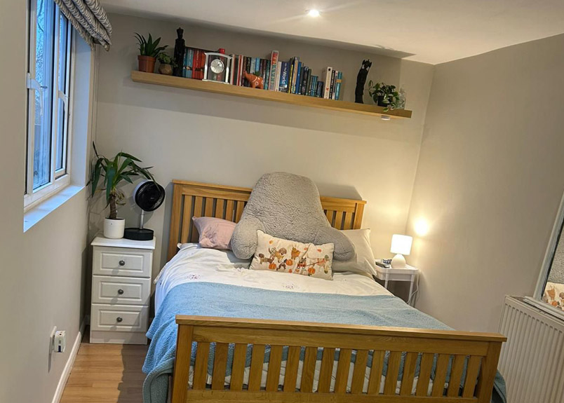 Painted hallway and staircase in Aylesbury with neat woodwork and bannisters